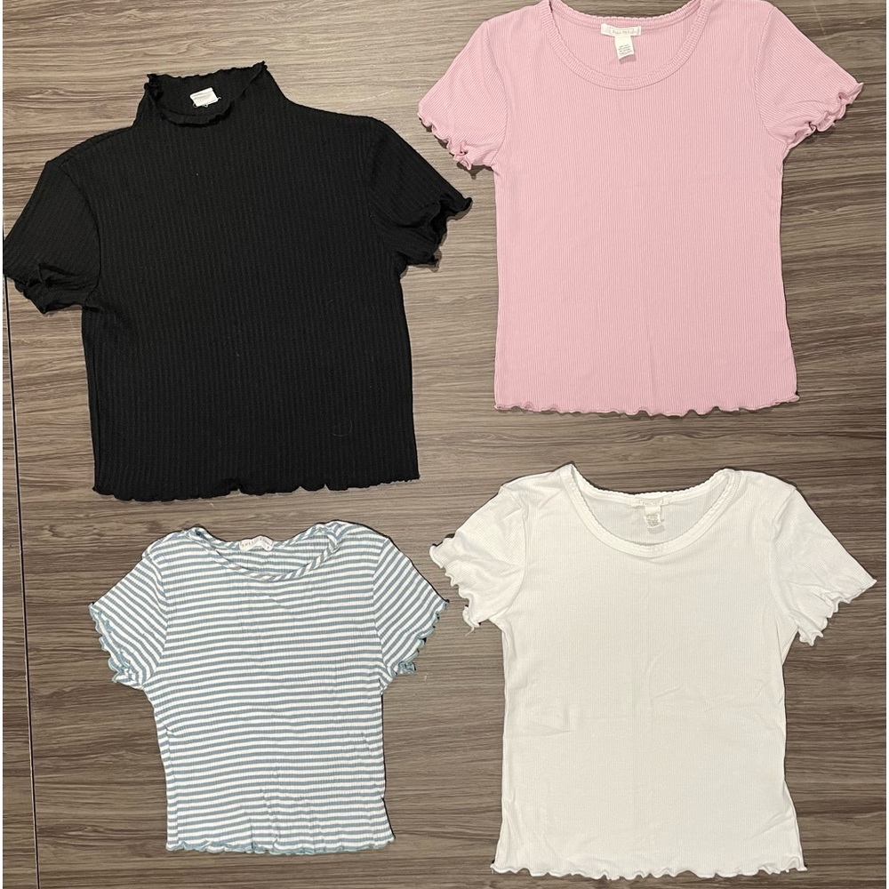 Four ruffled sleeve and waistband shirts